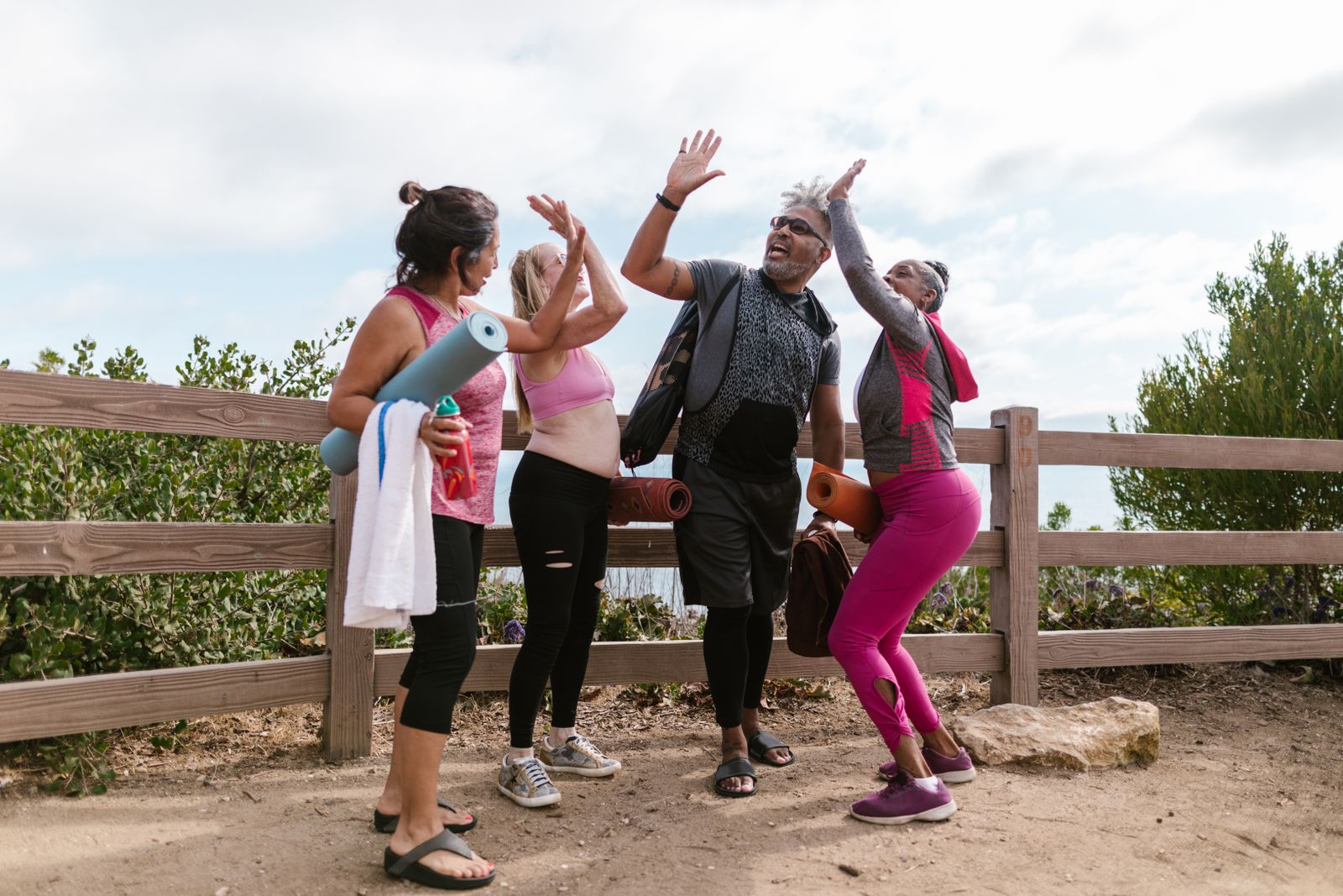 A group of older adults celebrating together after an outdoor activity