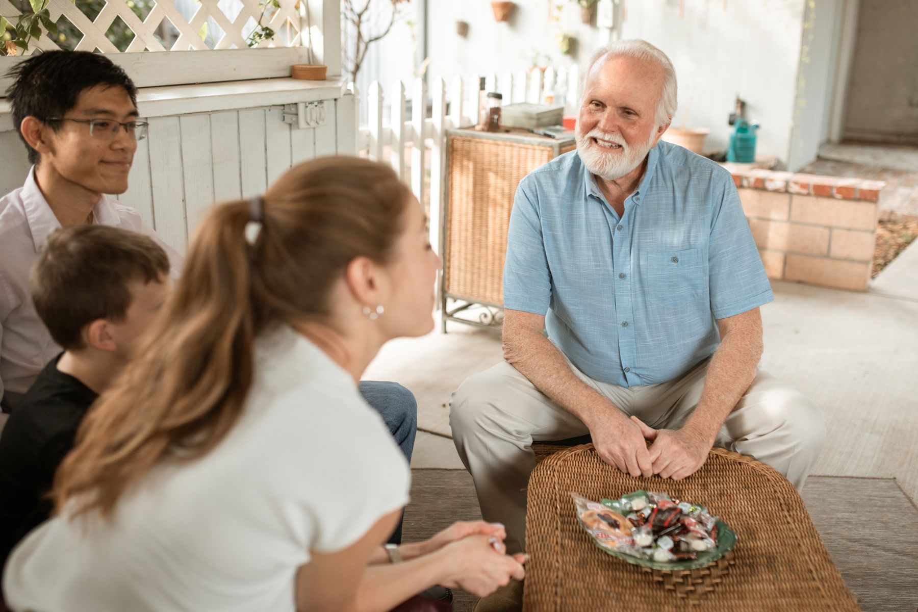 An older adult enjoying time with family in a welcoming home setting